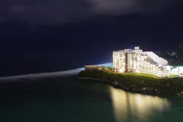 Reflection of the building in the night sea