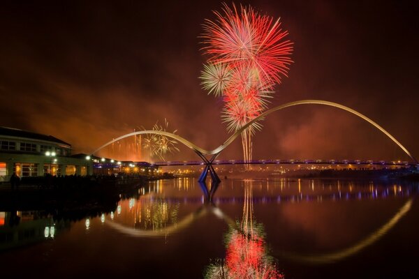 Night bridge across the river in the city