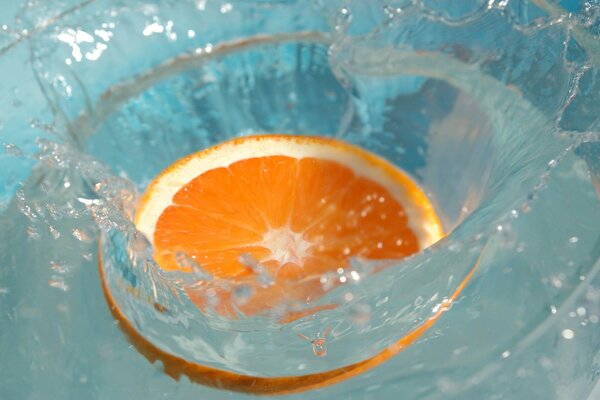 A picture with an orange in the water