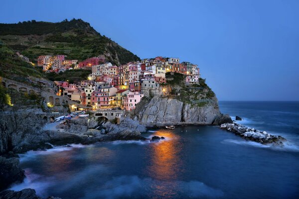 Italian city by the sea at sunset