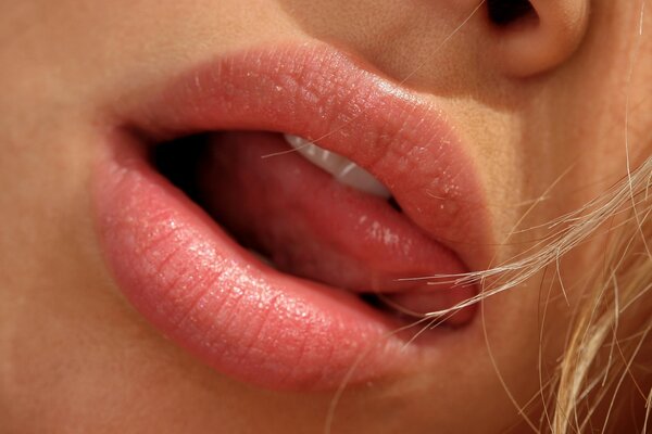 Women s lips with a sexy tongue