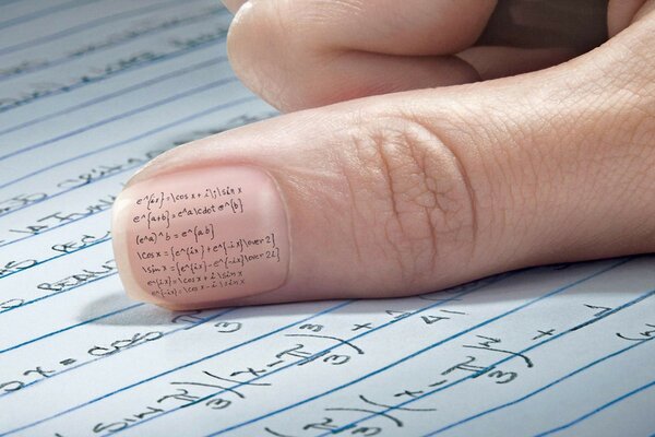 An inconspicuous cheat sheet on a nail with a pen