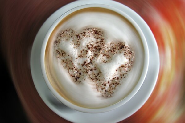 Cappuccino coffee with foam in the form of a heart