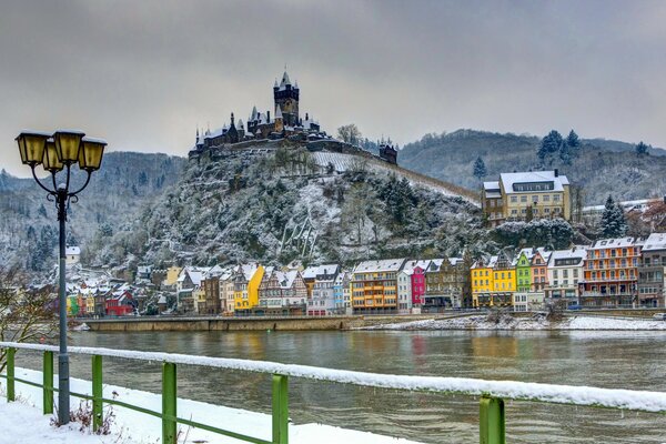 Winter houses on the river bank