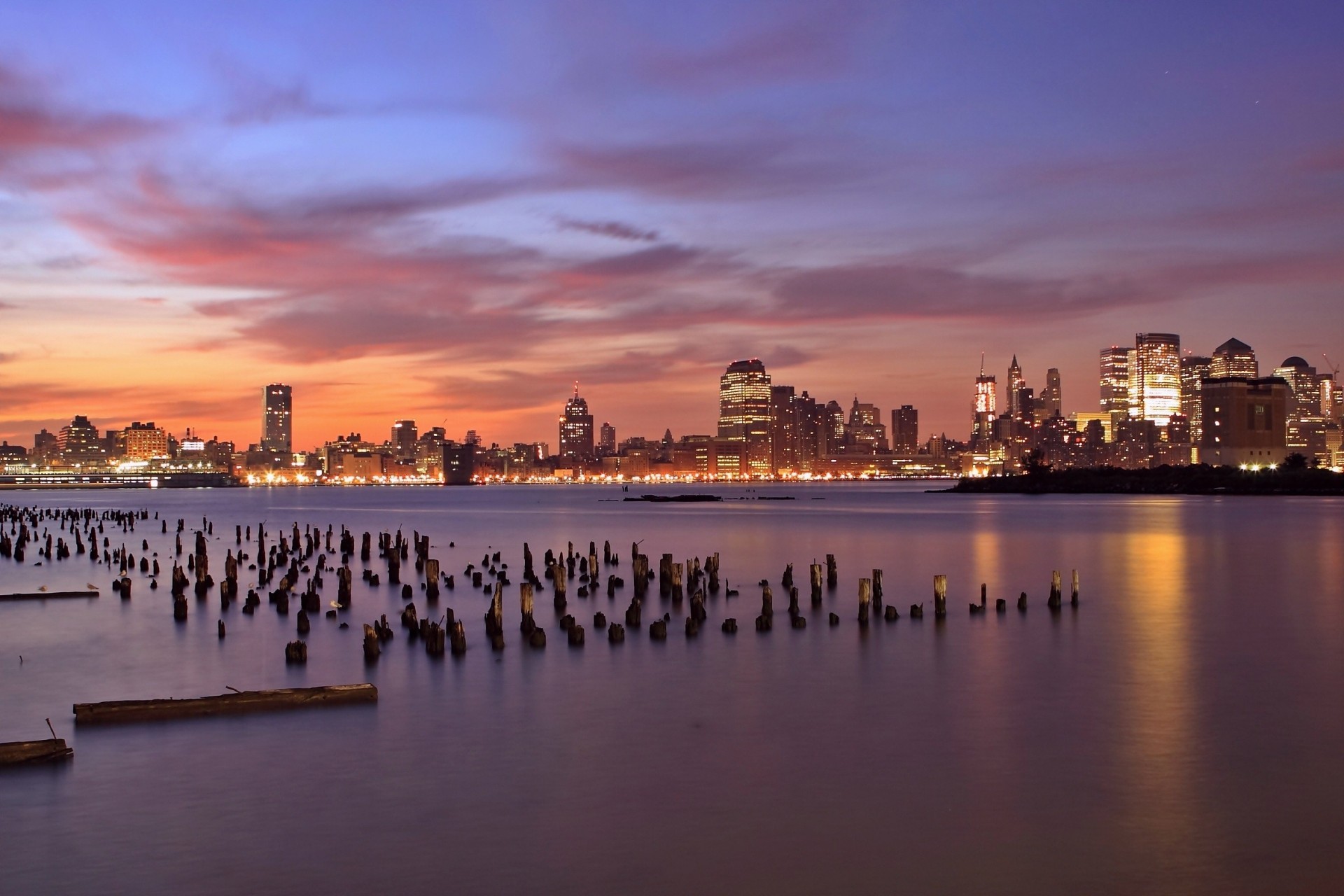 luces jersey city río nubes puesta de sol naranja rascacielos noche cielo hudson estados unidos nueva jersey