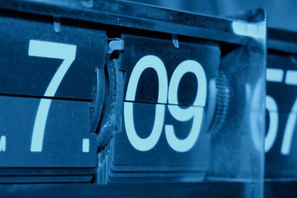 Macro shooting of a watch in blue and white tones