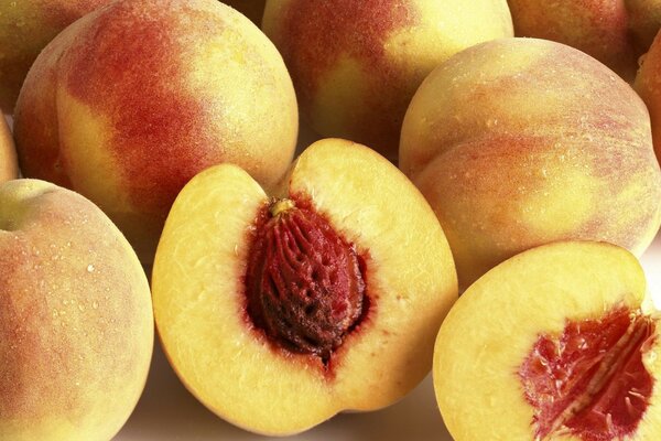 Juicy peach halves with a stone