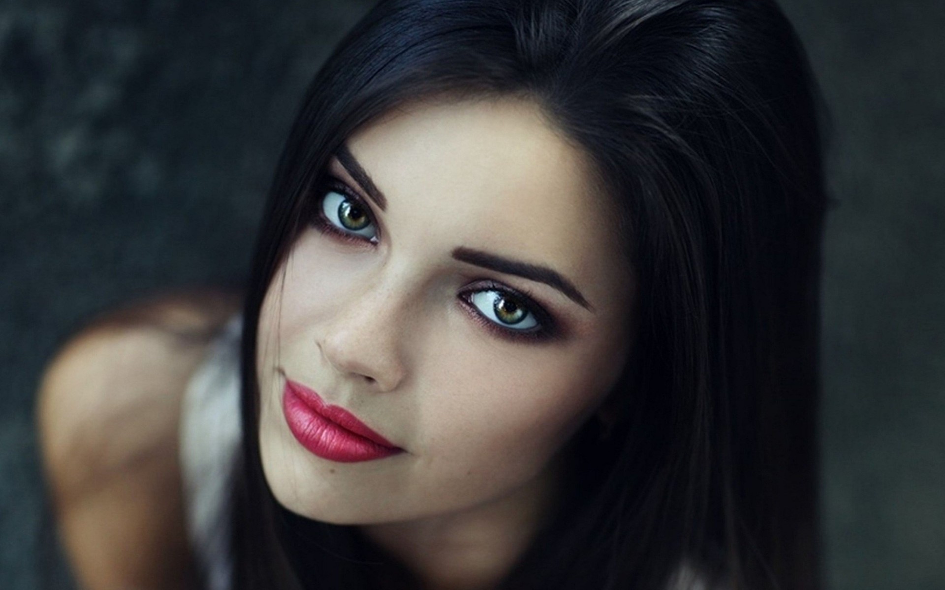 a woman girl lips brunette grey close up face