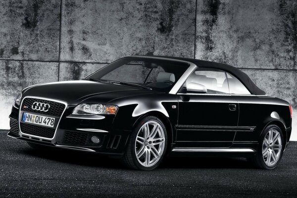 Black Audi on the wall background