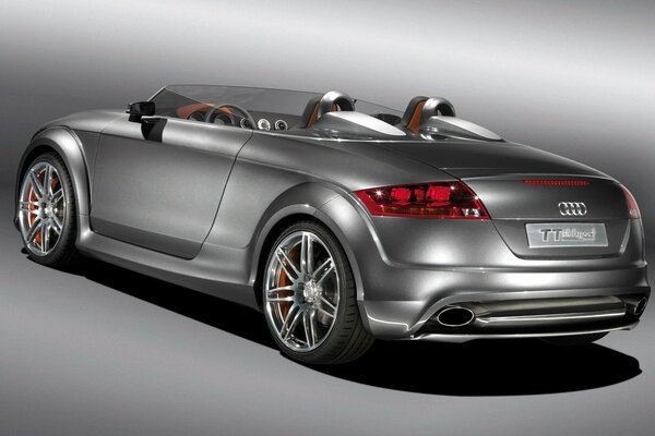Grey Audi TT in the back of a convertible