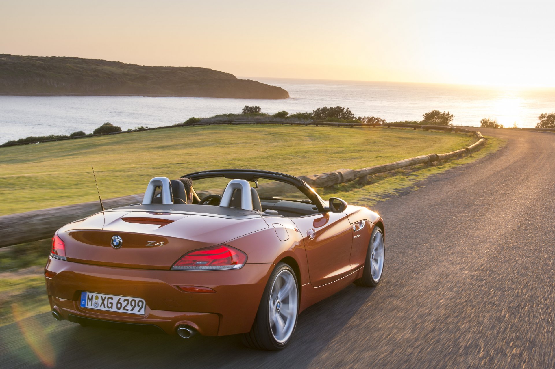 bmw boomer z4 roadster 2014 sport voiture rouge route rouge voitures mer soleil paysage bmw sans toit belle voiture voiture de sport coucher de soleil auto hd brouettes