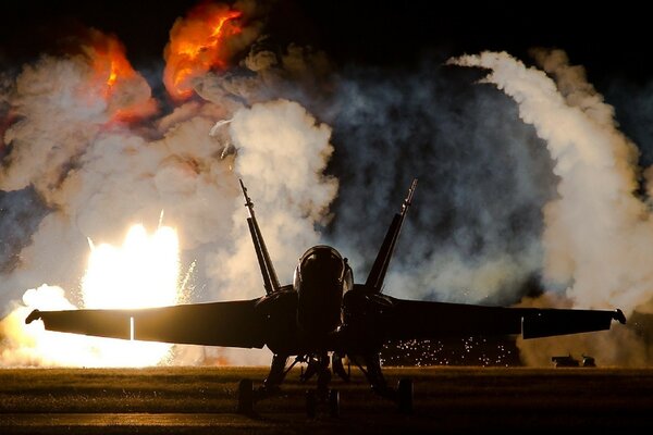 A military fighter jet on a background of white fog