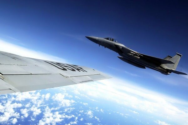 View of a squadron wing on a fighter in the sky