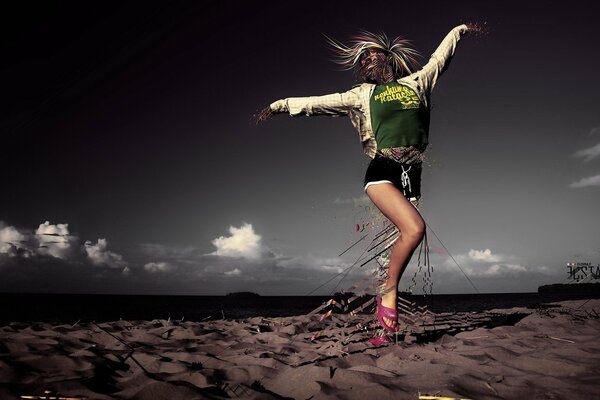 Girl on the sand on the beach posing