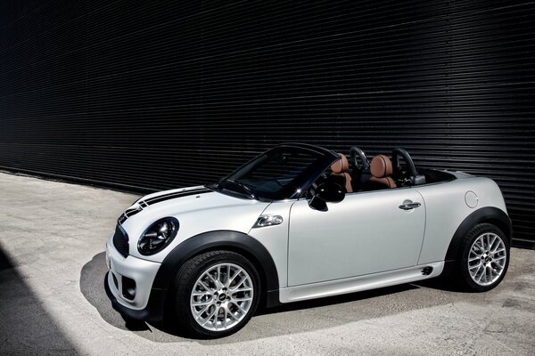 White mini Cooper with cool wheels and headlights