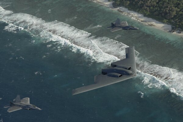 B-2 B and two f22s in the sky over the Pacific Ocean