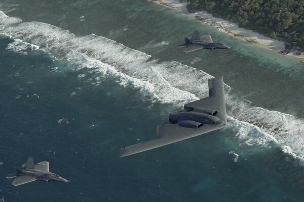 B-2 b y dos f22 en el cielo sobre el océano Pacífico
