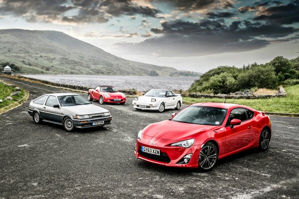 Four cars against the background of nature