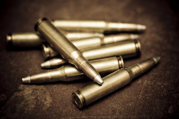 Photos of several bullets in processing