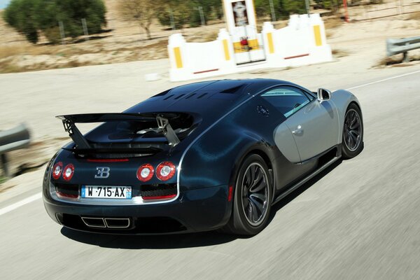 Bugatti Veyron sports car with raised wing