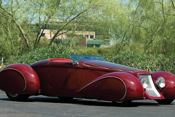 An old red sports convertible