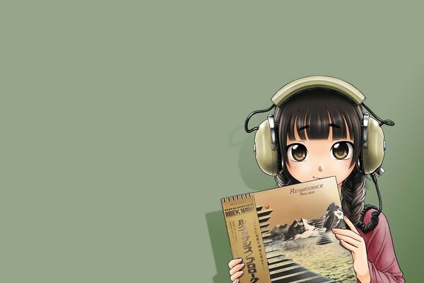 Kawaii girl in headphones with a record