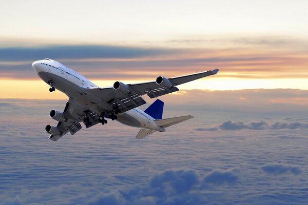 The flight of a passenger liner over the clouds