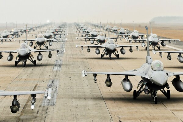 A lot of Su-25 aircraft are on the runway