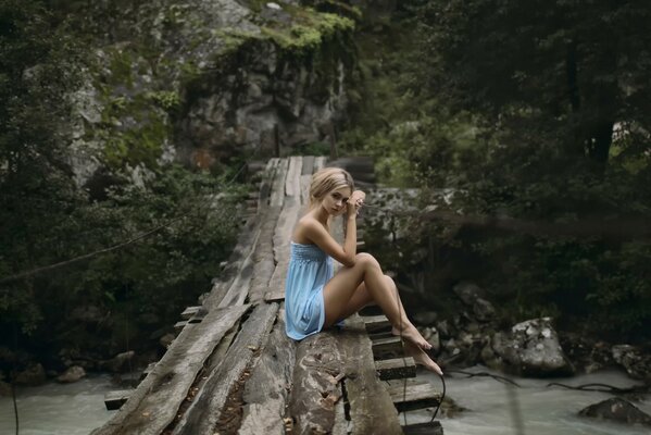 Girl on the bridge overlooking the river