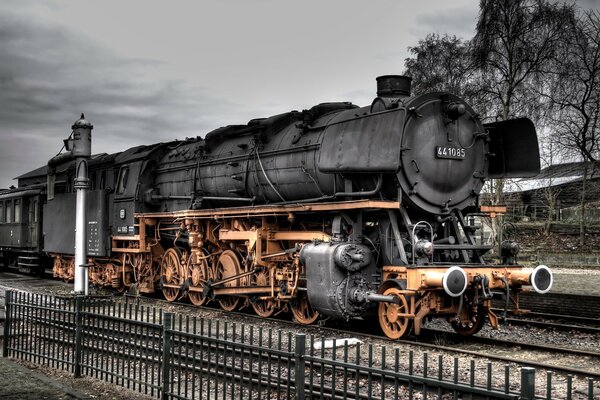 An old locomotive monument on the rails