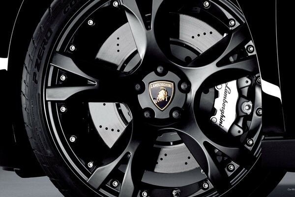 The wheel of a Lamborghini car is black
