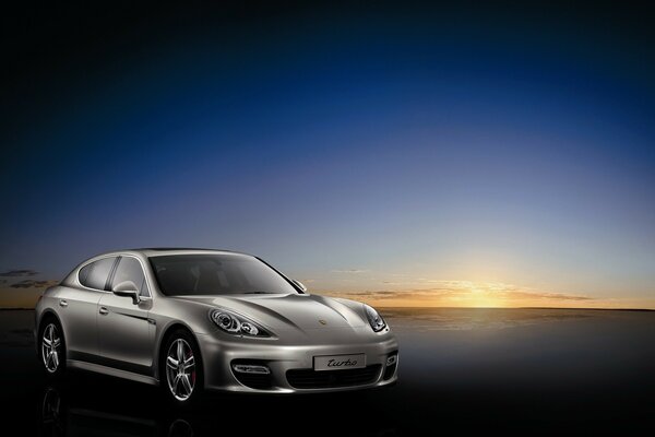 Porsche silver car at sunset