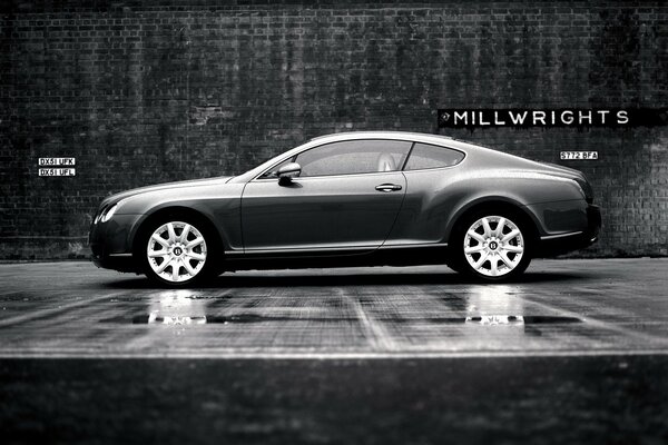 A chic Bentley on the background of a black and white wall