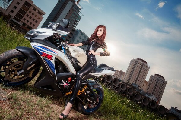 Beautiful girl sitting on a motorcycle