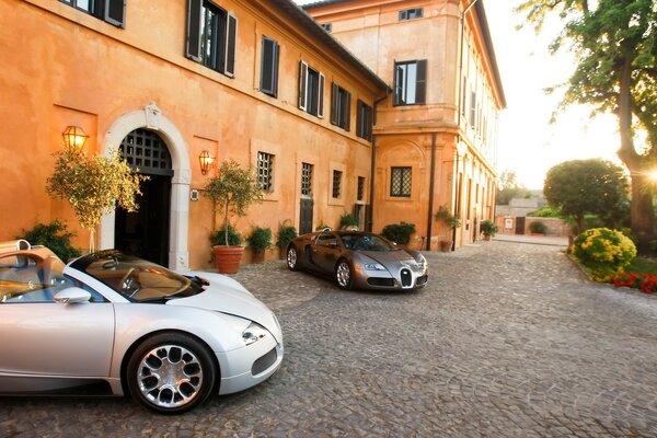 Bugatti sportive sur fond de belle maison