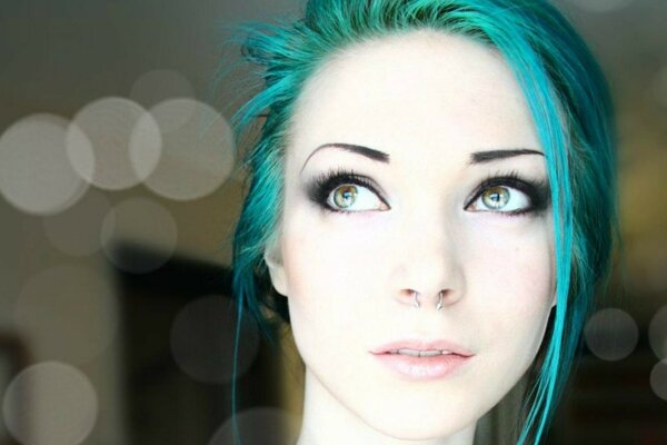 A girl with green hair and a nose piercing