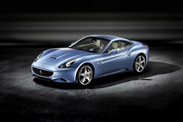 Blue ferrari california on a very dark background