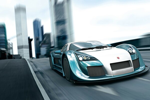 A blue sports car rides on the road against the backdrop of the city s skyscrapers