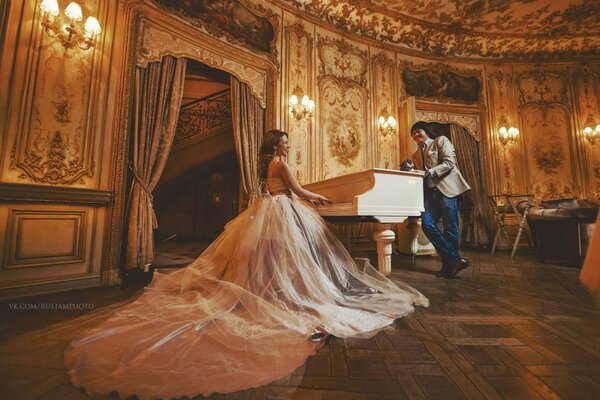 A couple at the white piano