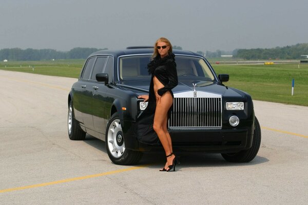 Rolls royce on the runway and a half-naked girl