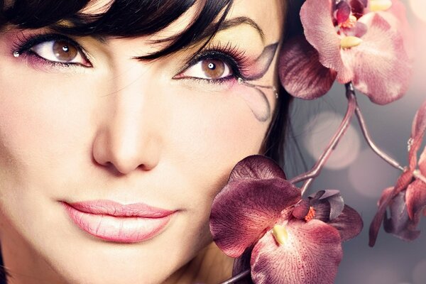 A woman with short hair and bangs with flowers