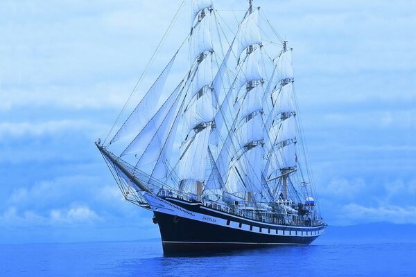 Sailing ship in the blue sea