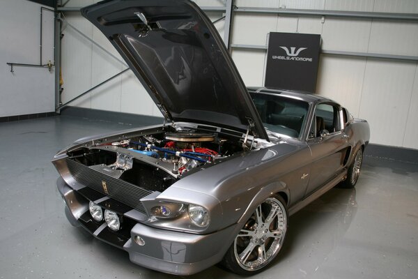 Photo of a mustang car with an open hood