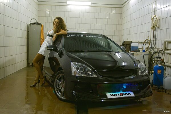 Honda in the garage and a girl in a white dress