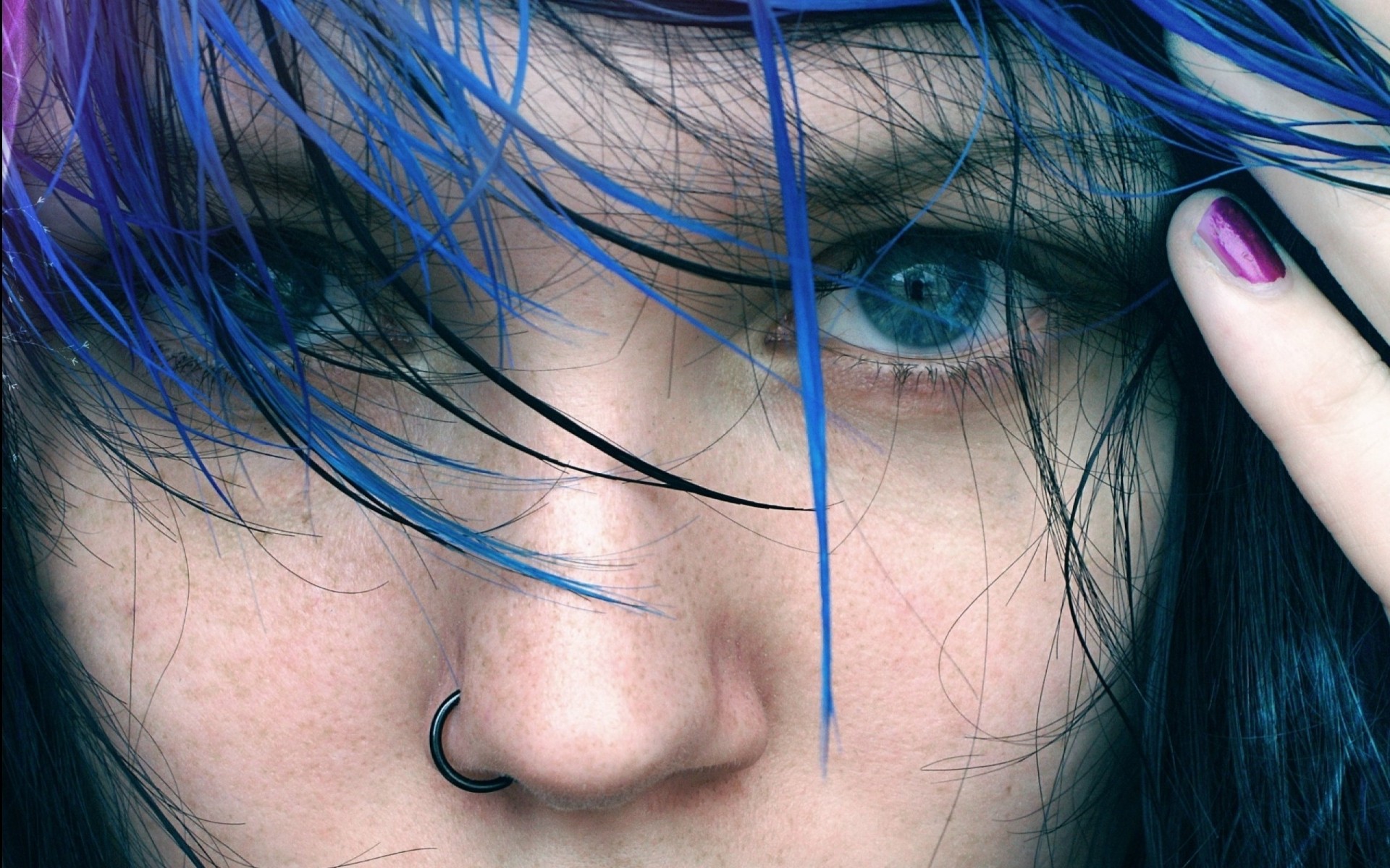 a woman girl eye close up blue hair face