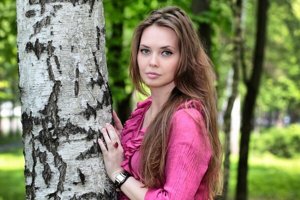 Oksana Malakhova in her youth with long hair