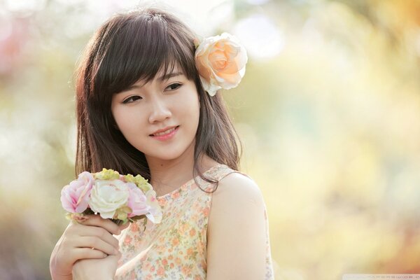 Romantic girl with a bouquet on a blurry background