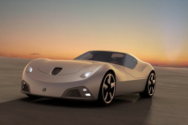 Beige car in the desert on the background of sunset