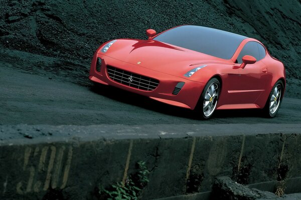 Red Ferrari drives through dark terrain
