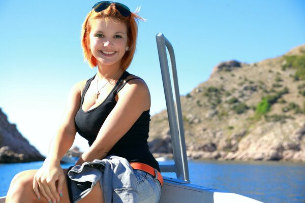 Beautiful model in a T-shirt on the sea